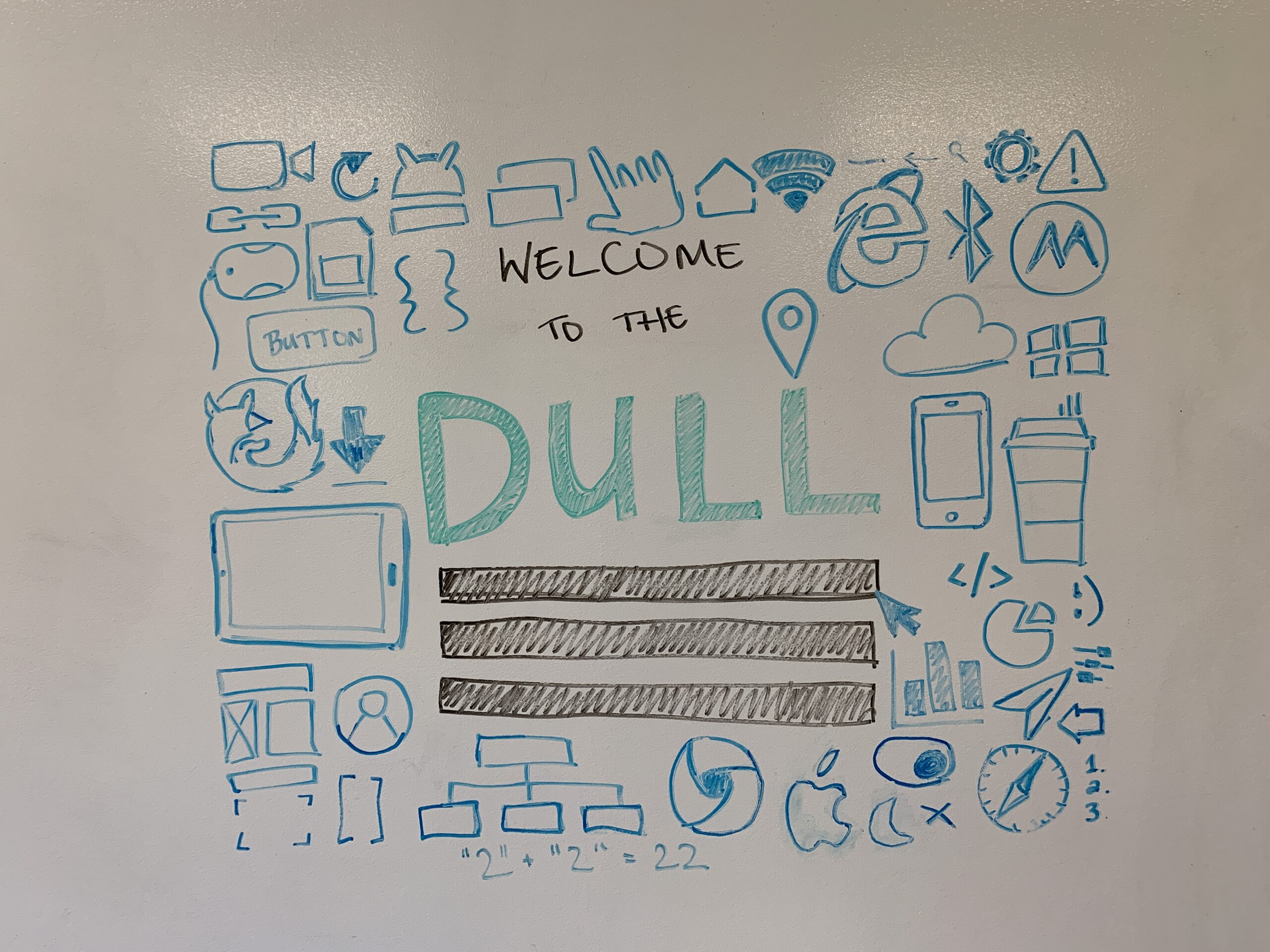 technology icons drawn in blue and black dry erase marker on the lab's whiteboard wall